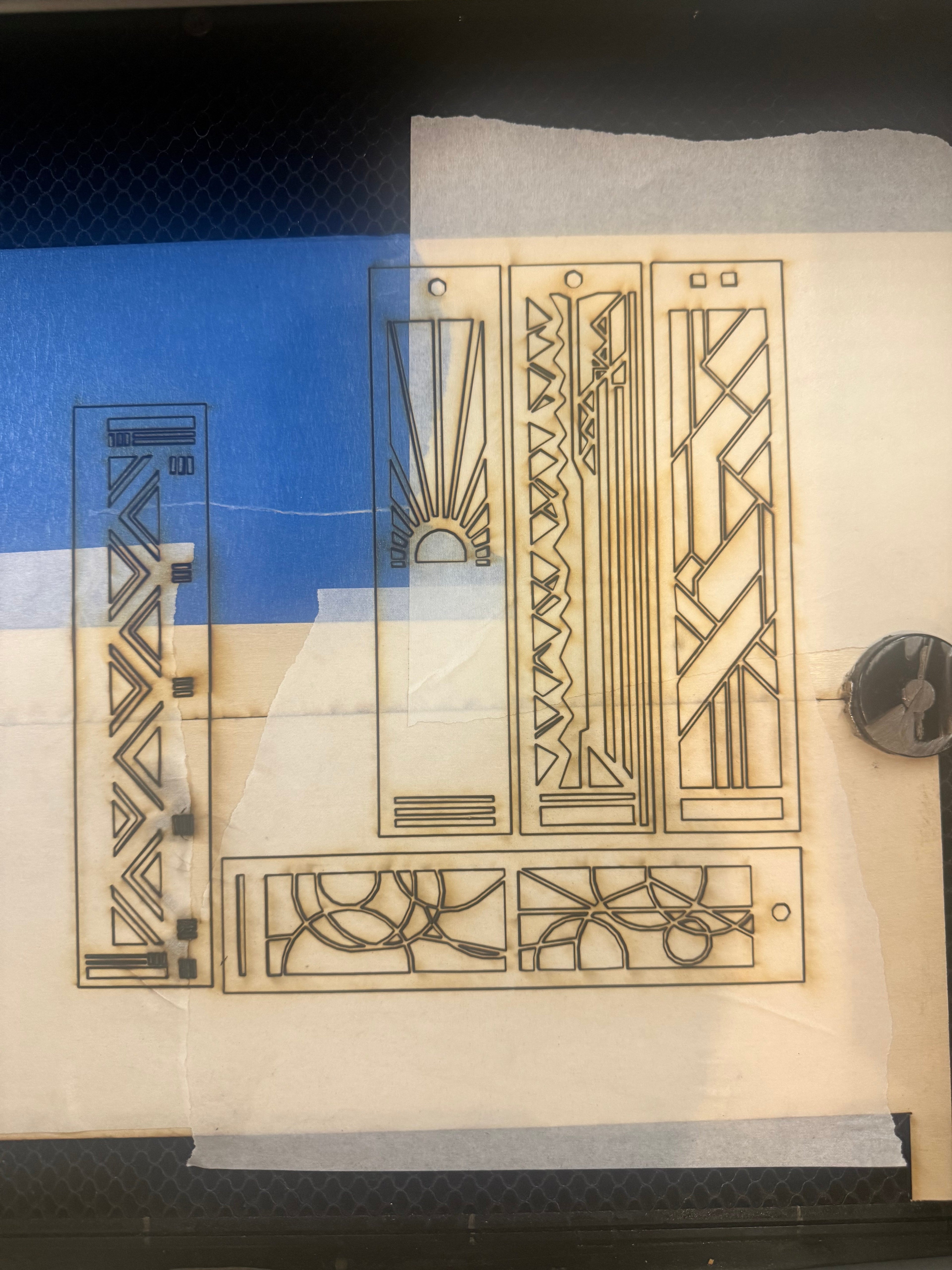 Laser-cut hardwood bookmark detail showing Prairie geometric linework